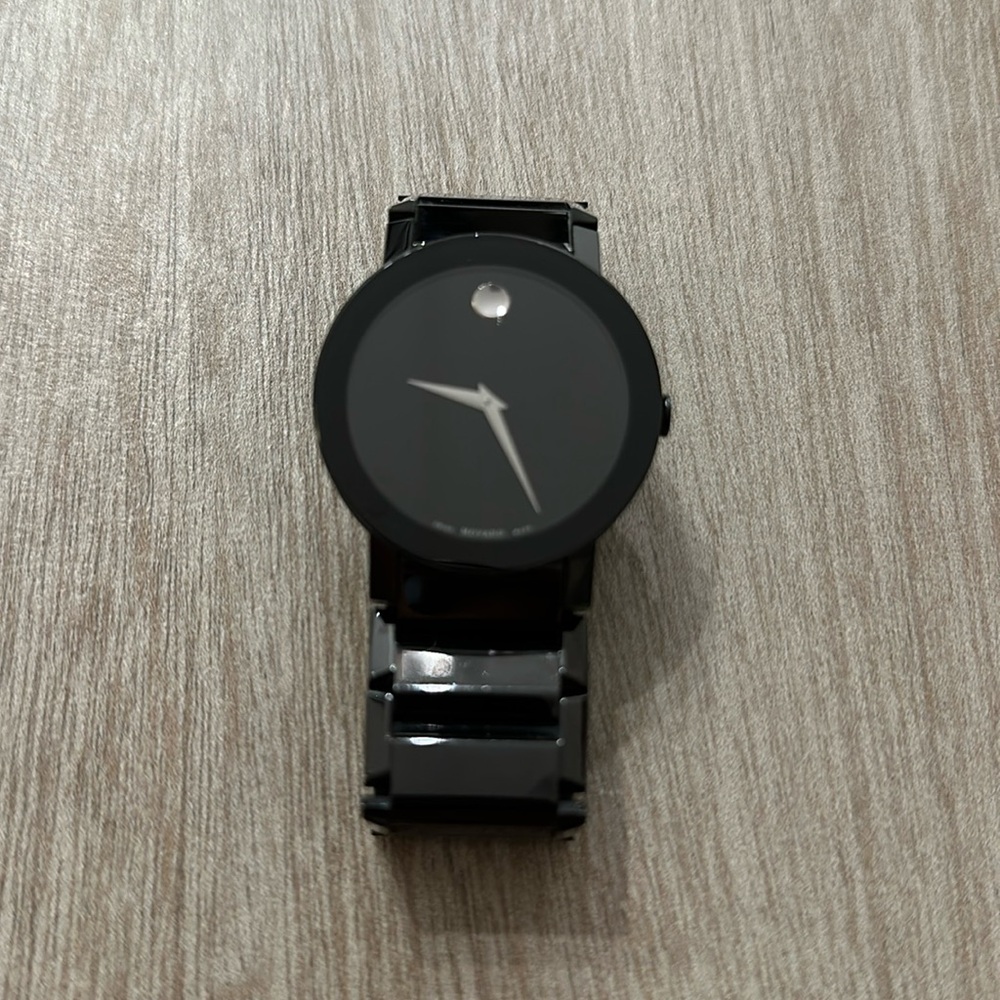 Movado watches ceramic super stylish. Used couple times. Looks brand new.